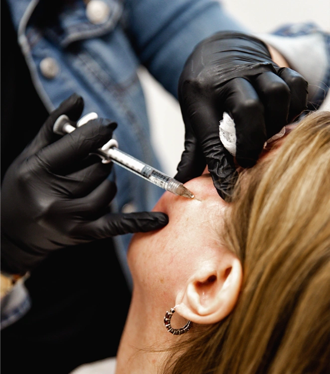 woman getting cheek injection