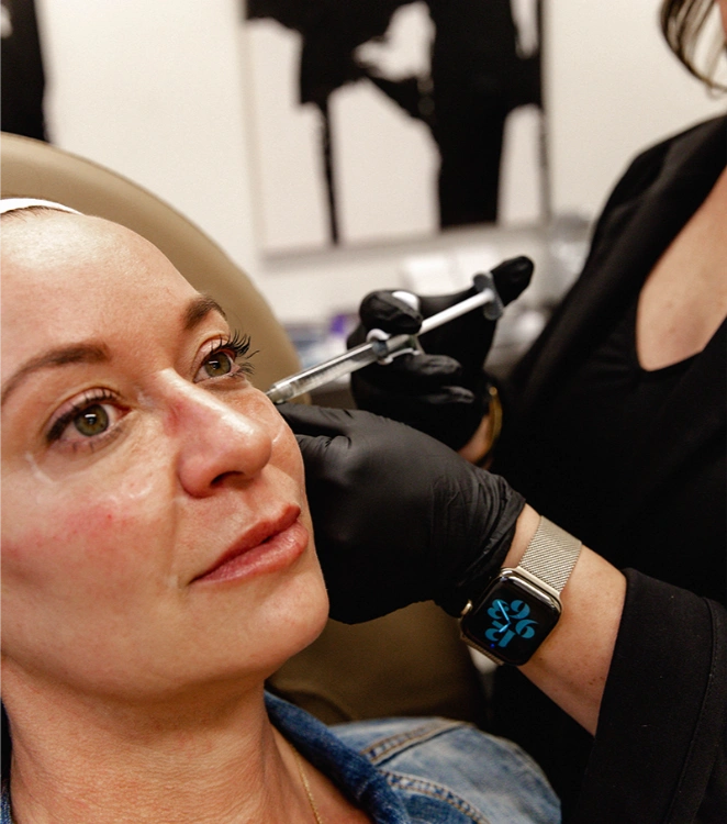 woman getting injectable treatment